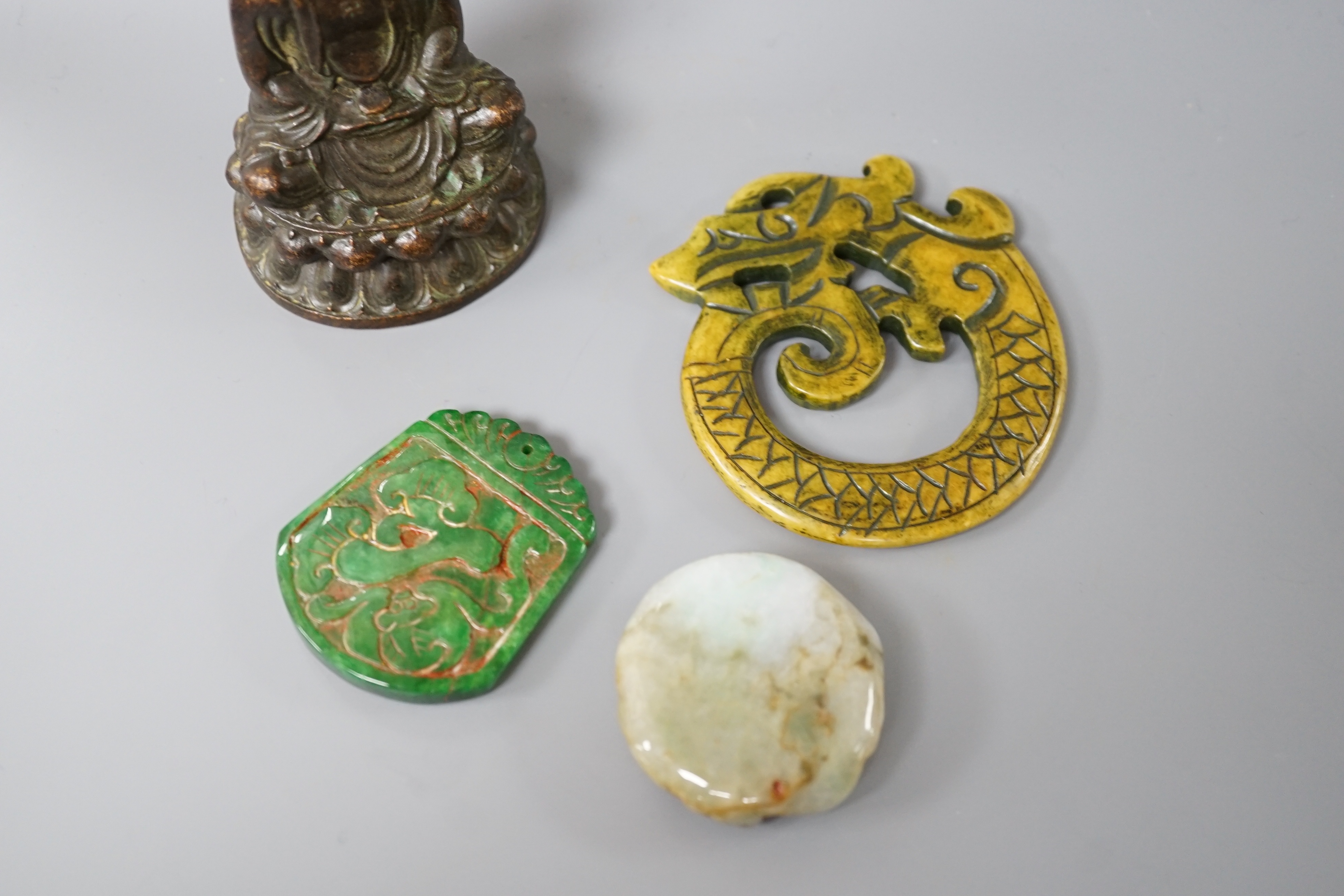 Three Chinese hard stone carvings and a bronze Buddha, 9.5cm